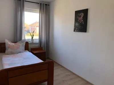 Ein Bett oder Betten in einem Zimmer der Unterkunft Lotus 5