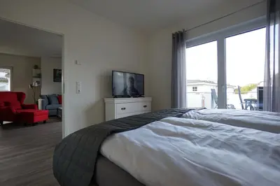 Ein Bett oder Betten in einem Zimmer der Unterkunft Penthouse am Deich