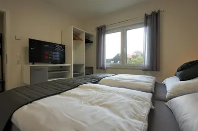 Ein Bett oder Betten in einem Zimmer der Unterkunft Penthouse am Deich