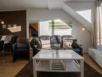 Ein Sitzbereich in der Unterkunft Residenz Rosengarten Wohnung 305 mit Meerblick