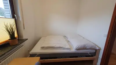 Ein Bett oder Betten in einem Zimmer der Unterkunft Ferienwohnung Meerverliebt