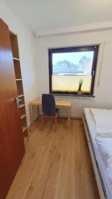 Ein Bett oder Betten in einem Zimmer der Unterkunft Ferienwohnung Meerverliebt