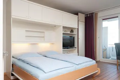 Ein Bett oder Betten in einem Zimmer der Unterkunft Haus Hanseatic, Wohnung 107