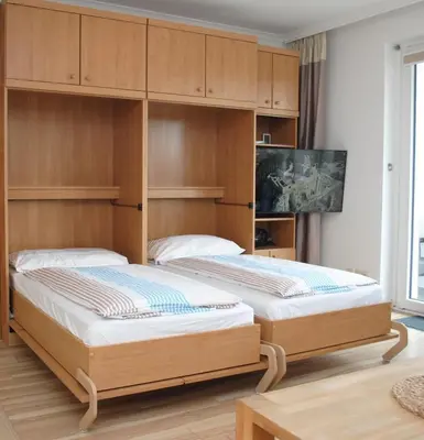 Ein Bett oder Betten in einem Zimmer der Unterkunft Haus Hanseatic, Wohnung 212