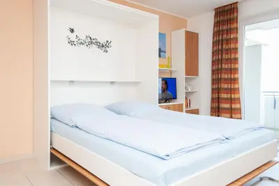 Ein Bett oder Betten in einem Zimmer der Unterkunft Haus Hanseatic, Wohnung 210