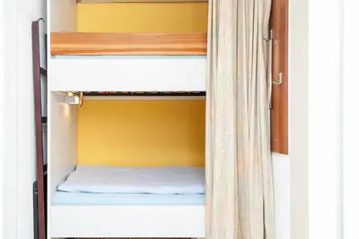 Ein Bett oder Betten in einem Zimmer der Unterkunft Haus Hanseatic, Wohnung 210