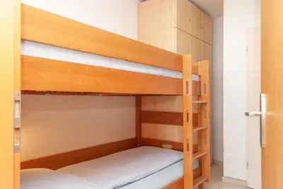 Ein Bett oder Betten in einem Zimmer der Unterkunft Haus Hanseatic, Wohnung 309