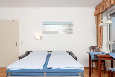 Ein Bett oder Betten in einem Zimmer der Unterkunft Haus Hanseatic, Wohnung 401
