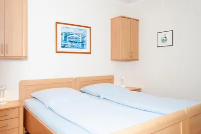 Ein Bett oder Betten in einem Zimmer der Unterkunft Haus Hanseatic, Wohnung 401