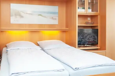 Ein Bett oder Betten in einem Zimmer der Unterkunft Haus Hanseatic, Wohnung 409