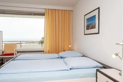 Ein Bett oder Betten in einem Zimmer der Unterkunft Haus Hanseatic, Wohnung 406