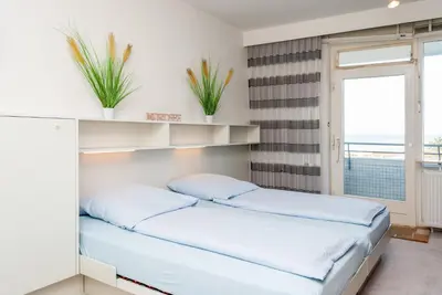 Ein Bett oder Betten in einem Zimmer der Unterkunft Haus Hanseatic, Wohnung 509
