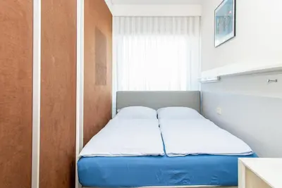 Ein Bett oder Betten in einem Zimmer der Unterkunft Haus Hanseatic, Wohnung 509