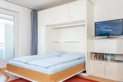 Ein Bett oder Betten in einem Zimmer der Unterkunft Haus Hanseatic, Wohnung 503