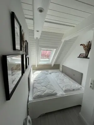 Ein Bett oder Betten in einem Zimmer der Unterkunft Nordseetraum - Ferienhaus Wolke