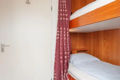 Ein Bett oder Betten in einem Zimmer der Unterkunft Haus Hanseatic, Wohnung 604