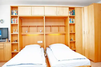 Ein Bett oder Betten in einem Zimmer der Unterkunft Haus Hanseatic, Wohnung 610