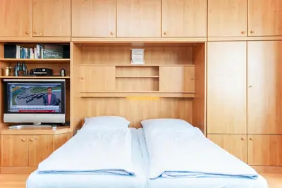 Ein Bett oder Betten in einem Zimmer der Unterkunft Haus Hanseatic, Wohnung 710