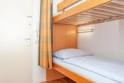 Ein Bett oder Betten in einem Zimmer der Unterkunft Haus Hanseatic, Wohnung 801