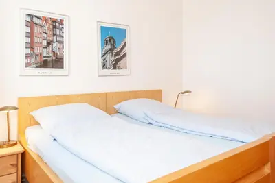Ein Bett oder Betten in einem Zimmer der Unterkunft Haus Hanseatic, Wohnung 712