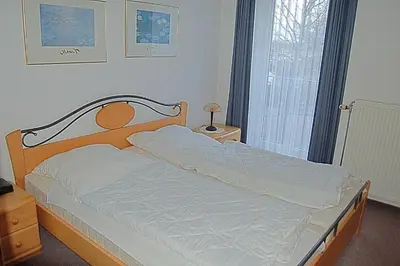Ein Bett oder Betten in einem Zimmer der Unterkunft Seepferdchen