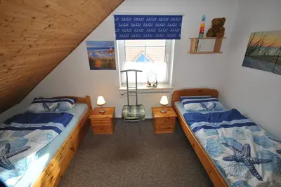 Ein Bett oder Betten in einem Zimmer der Unterkunft Medemstern II