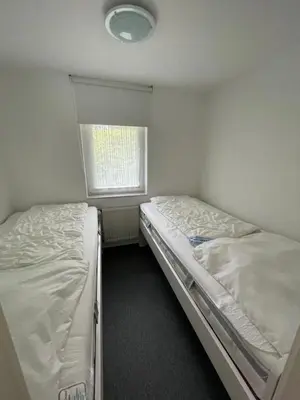 Ein Bett oder Betten in einem Zimmer der Unterkunft Badehausallee 20 Bungalow