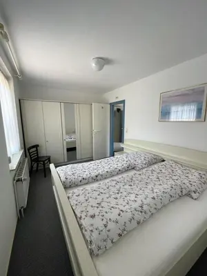 Ein Bett oder Betten in einem Zimmer der Unterkunft Haus Nordseegruß 3
