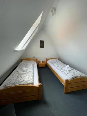Ein Bett oder Betten in einem Zimmer der Unterkunft Haus Nordseegruß 2