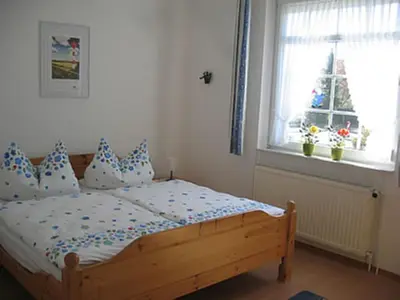 Ein Bett oder Betten in einem Zimmer der Unterkunft Badehausallee 20 Wohnung 1
