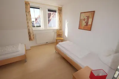 Ein Bett oder Betten in einem Zimmer der Unterkunft Haus Albatros