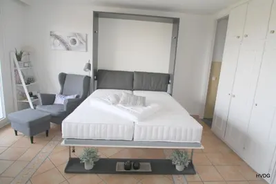 Ein Bett oder Betten in einem Zimmer der Unterkunft FW mit traumhaftem Meerblick in Büsum