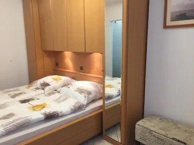 Ein Bett oder Betten in einem Zimmer der Unterkunft Nautilus, Ferienwohnung 12 inkl Strandkorb