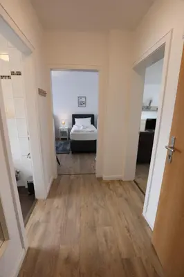 Ein Bett oder Betten in einem Zimmer der Unterkunft Rugenbargsweg 27 Whg 2