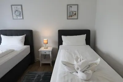 Ein Bett oder Betten in einem Zimmer der Unterkunft Rugenbargsweg 27 Whg 2