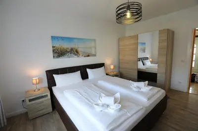 Ein Bett oder Betten in einem Zimmer der Unterkunft Rugenbargsweg 27 Whg 1