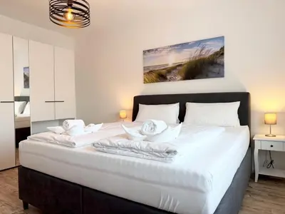Ein Bett oder Betten in einem Zimmer der Unterkunft Rugenbargsweg 29 Whg 2