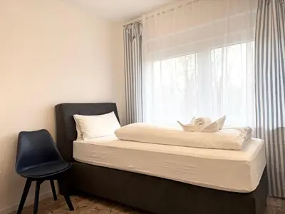 Ein Bett oder Betten in einem Zimmer der Unterkunft Rugenbargsweg 29 Whg 2